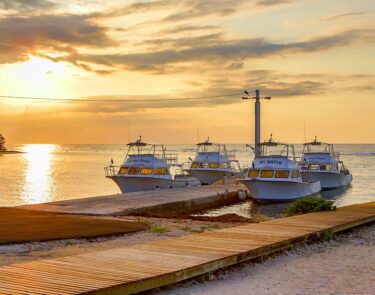 cayman brac four boats docked sunset 1060x834min